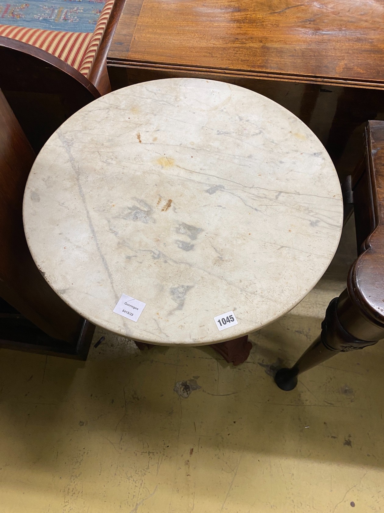 A Victorian style painted cast metal circular top marble top table, diameter 56cm, height 70cm